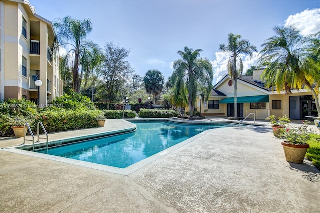 view of swimming pool featuring a patio area