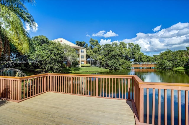 wooden deck with a water view