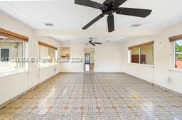 unfurnished room featuring ceiling fan