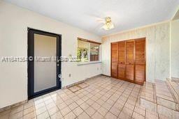 foyer entrance with light tile patterned floors