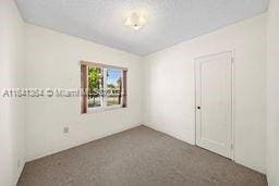 unfurnished bedroom featuring carpet floors