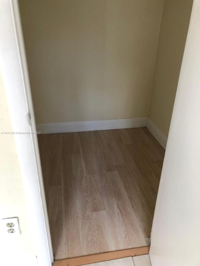 spare room featuring light hardwood / wood-style floors