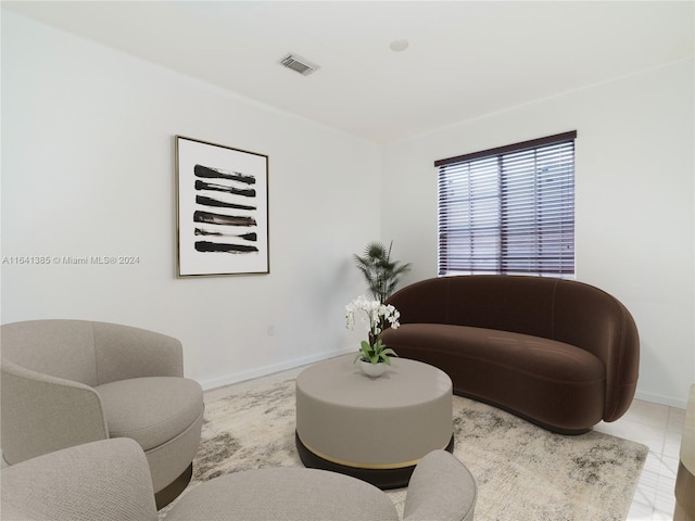 sitting room featuring tile patterned floors