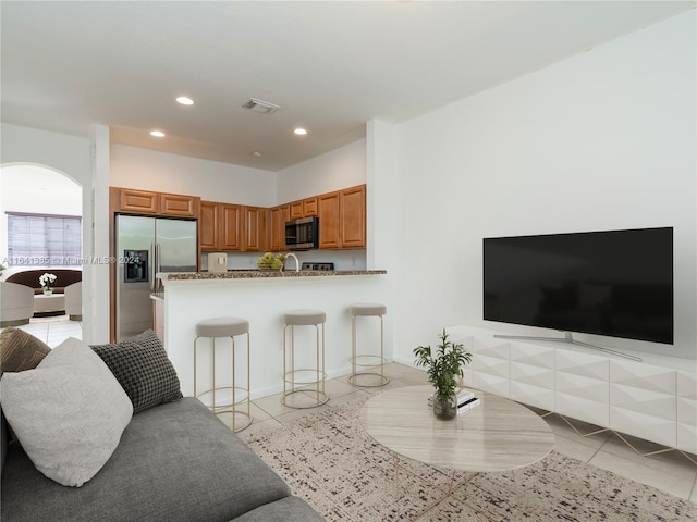 living room with light tile patterned floors