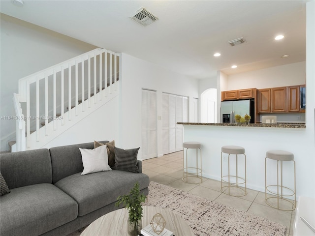 living room featuring light tile patterned floors