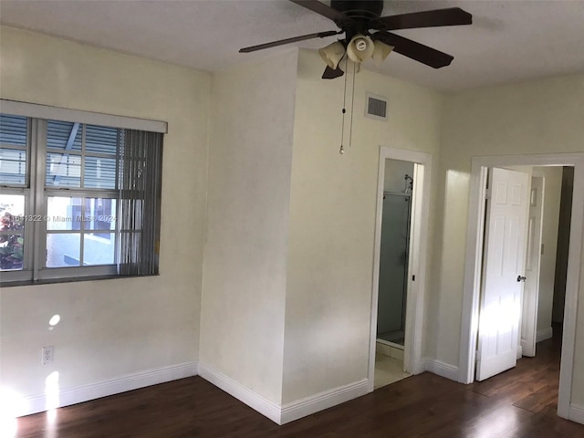 unfurnished bedroom with a closet, ceiling fan, and dark hardwood / wood-style floors