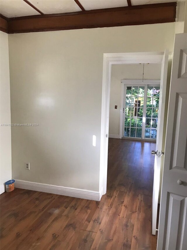 hall with dark hardwood / wood-style floors