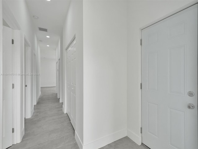 hall with light hardwood / wood-style flooring