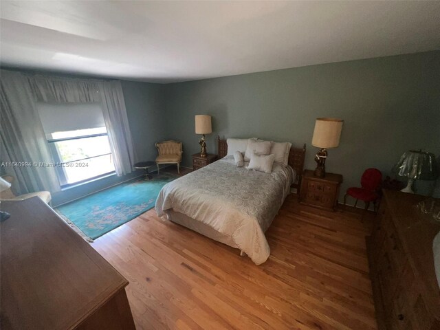 bedroom with wood-type flooring