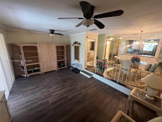 unfurnished living room with dark wood-style floors, visible vents, crown molding, and an inviting chandelier