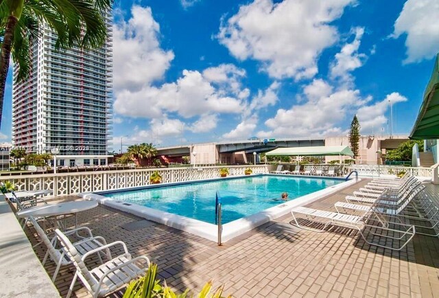 view of swimming pool featuring a patio