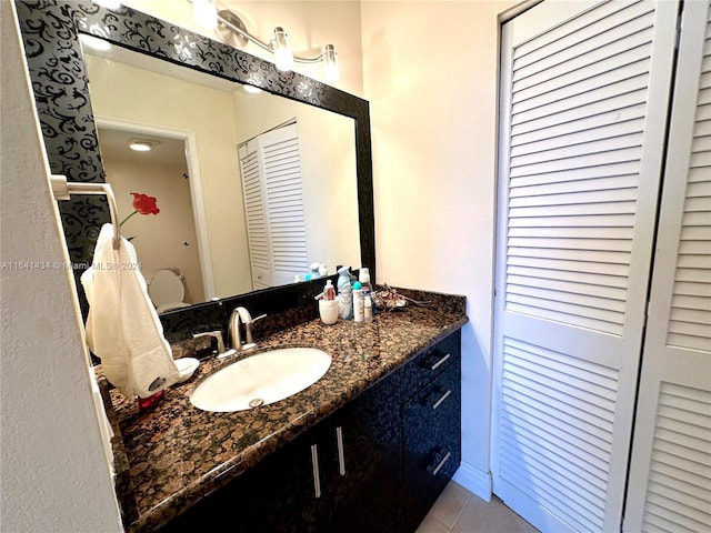 bathroom with tile patterned floors and vanity