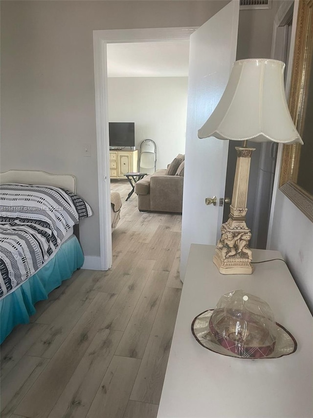 bedroom featuring hardwood / wood-style flooring