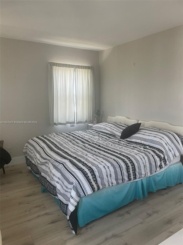 bedroom with wood-type flooring