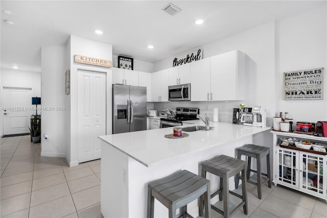 laundry room featuring washing machine and clothes dryer and light hardwood / wood-style floors