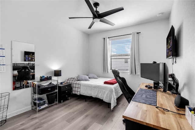 bedroom featuring ceiling fan and light hardwood / wood-style floors