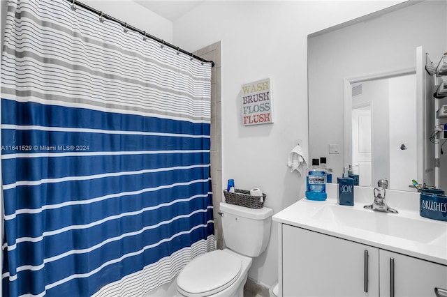 bathroom with vanity, toilet, and a shower with shower curtain