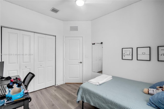 bedroom featuring a closet and light hardwood / wood-style floors