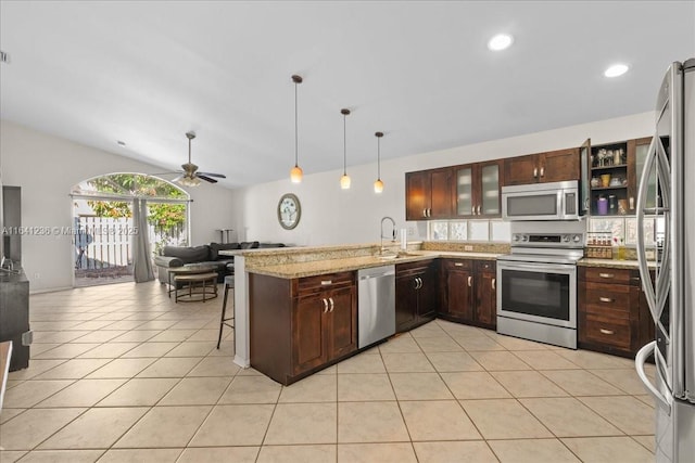18022 SW 12th Ct, Pembroke Pines, FL 33029 - kitchen featuring stainless steel appliances, open floor plan, a peninsula, vaulted ceiling, and ceiling fan