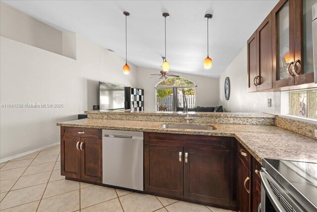 kitchen with ceiling fan, dishwasher, light tile patterned floors, vaulted ceiling, and sink