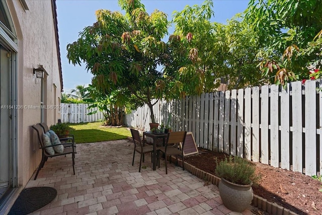 18022 SW 12th Ct, Pembroke Pines, FL 33029 - fenced backyard with a patio and outdoor dining area
