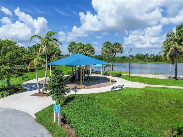 18022 SW 12th Ct, Pembroke Pines, FL 33029 - view of community with a yard, a water view, and concrete driveway