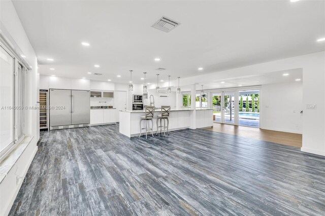 unfurnished living room featuring wood-type flooring