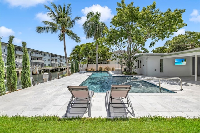 view of swimming pool with a patio