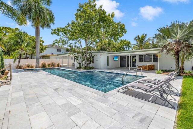 view of swimming pool featuring a patio