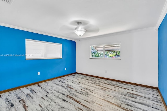 empty room with ceiling fan, light hardwood / wood-style flooring, and crown molding