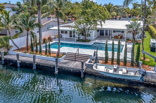 back of house featuring a patio area and a water view