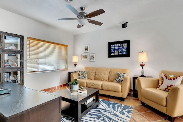 tiled living room with ceiling fan