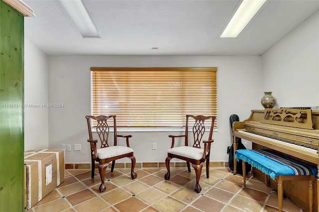 living area with tile patterned floors