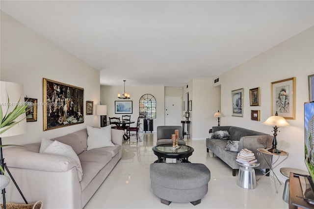 tiled living room with an inviting chandelier