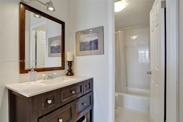 full bathroom with vanity, toilet, and shower / bath combo with shower curtain