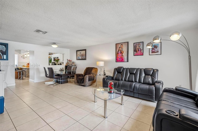 tiled living room with a textured ceiling