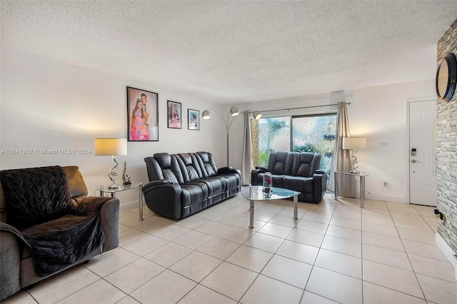 tiled living room featuring a textured ceiling