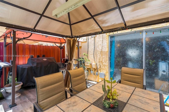 view of patio with grilling area and a gazebo