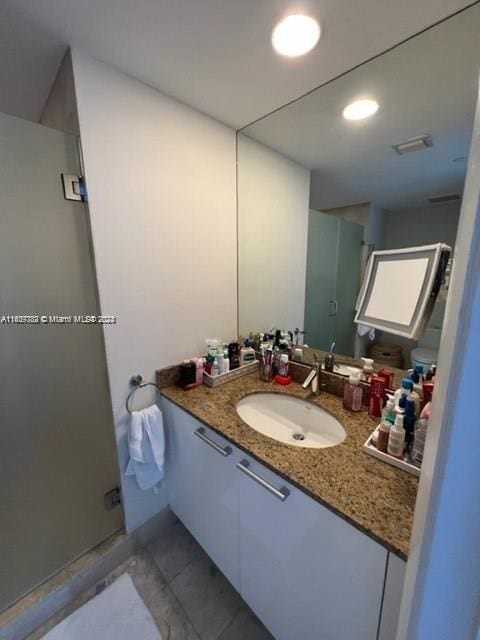 bathroom featuring tile patterned floors and vanity