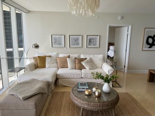 living room with a chandelier