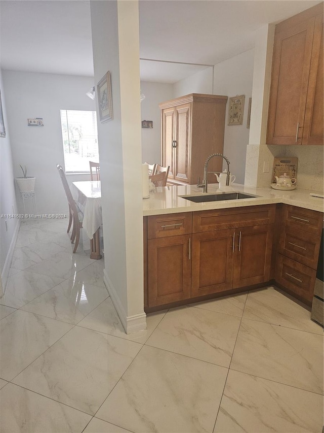 kitchen with decorative backsplash and sink