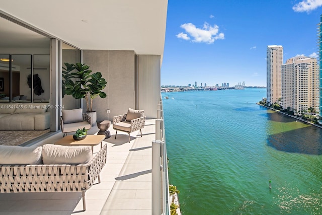 balcony featuring a water view