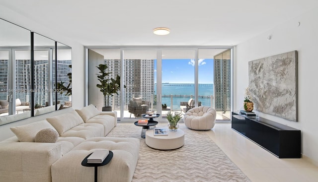 living room with a water view and expansive windows