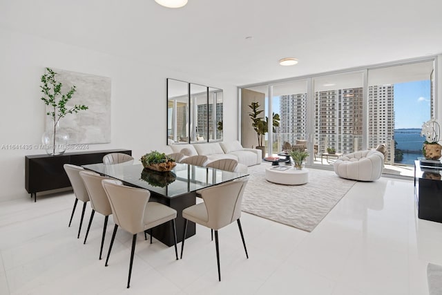 tiled dining area featuring a water view