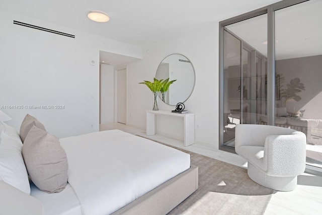 bedroom featuring light wood-type flooring