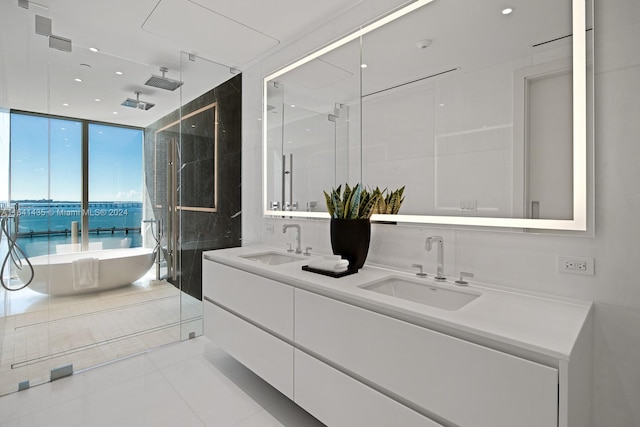 bathroom featuring plus walk in shower, vanity, tile patterned flooring, and floor to ceiling windows