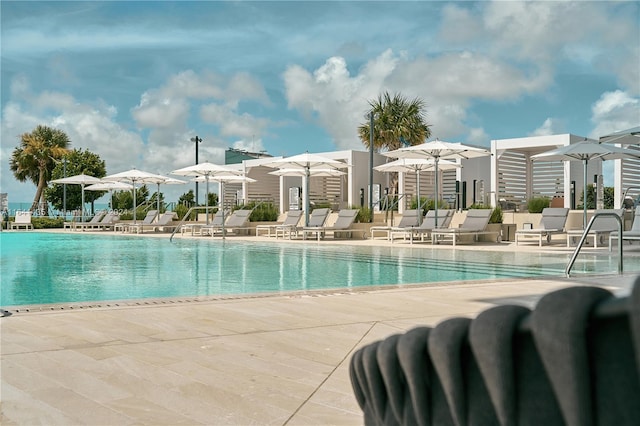 view of pool featuring a patio