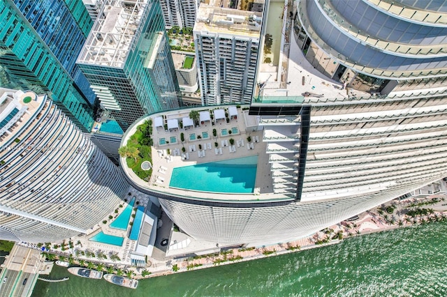 birds eye view of property with a water view