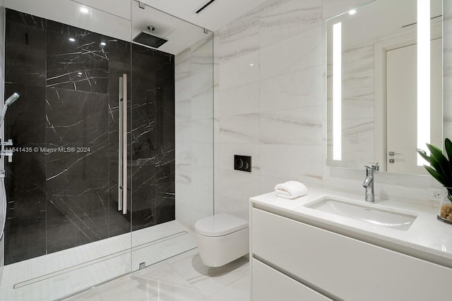 bathroom featuring tiled shower, vanity, toilet, and tile walls