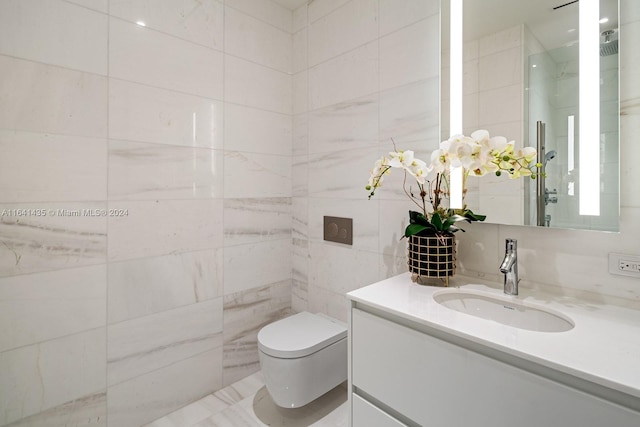 bathroom featuring vanity, toilet, and tile walls